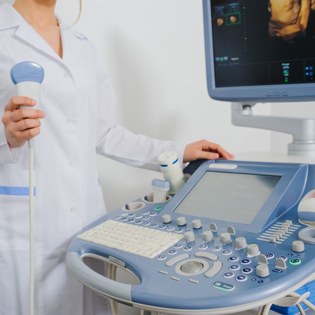 an ultrasound technician using an advanced ultrasound machine