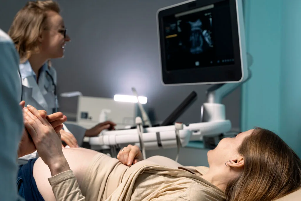 gynecologist-performing-ultrasound-consultation (1) gynecologist-performing-ultrasound-consultation (1)