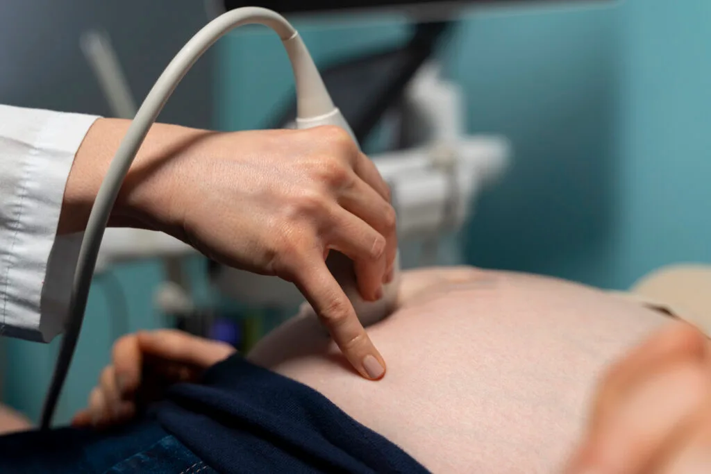 gynecologist-performing-ultrasound-consultation gynecologist-performing-ultrasound-consultation